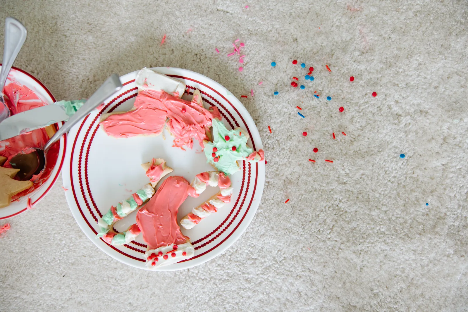 christmas cookie mess on white carpet