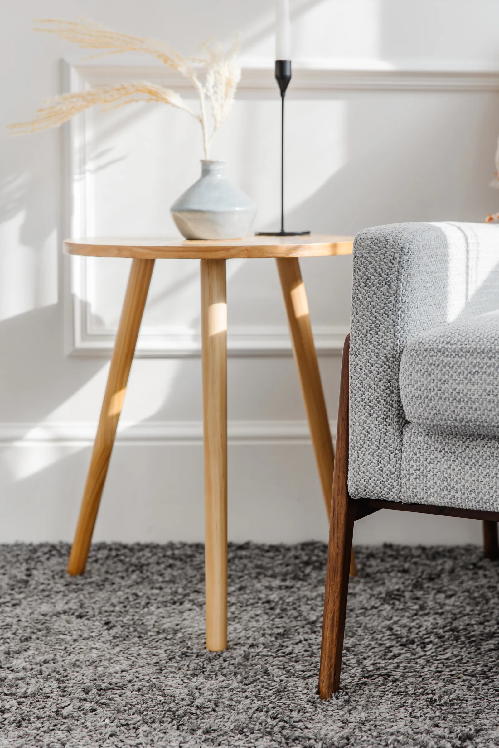 wooden side table and chair with vase
