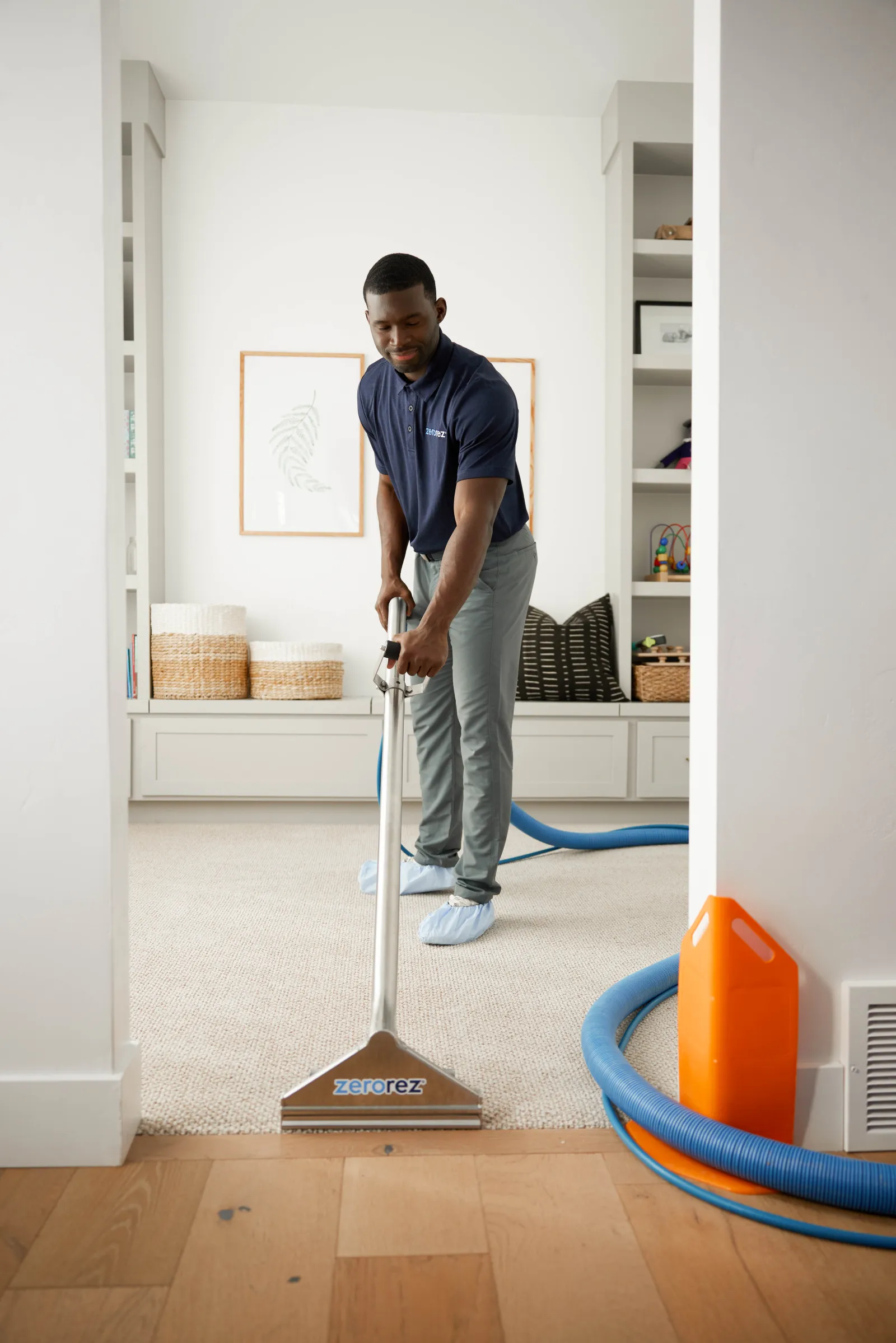 zerorez technician in room with cleaning wand