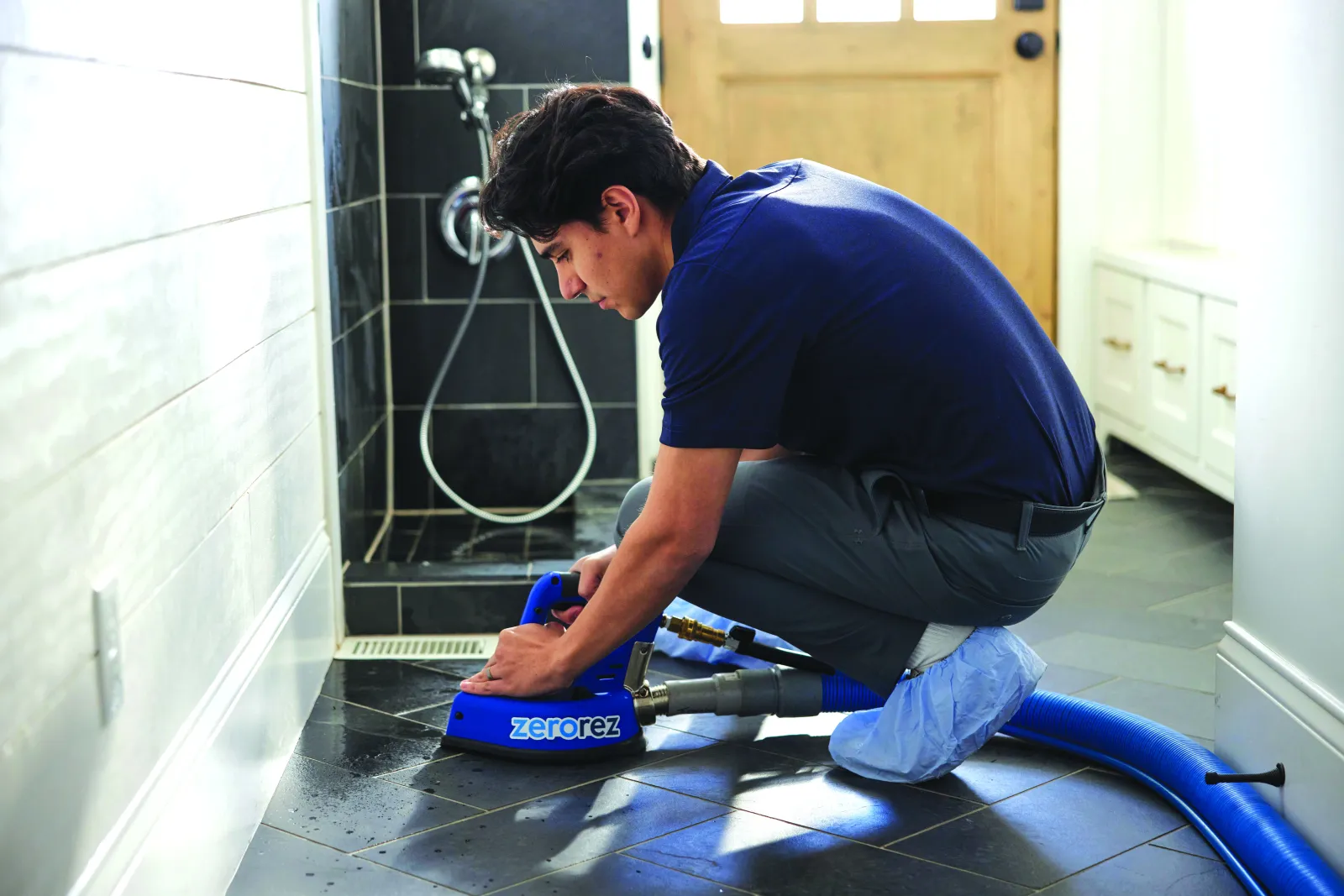 black tile cleaned by zerorez technician in bathroom